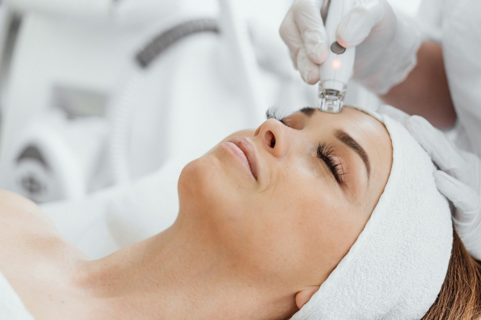 A professional esthetician uses the RF Lifting procedure to rejuvenate and tighten the skin of the